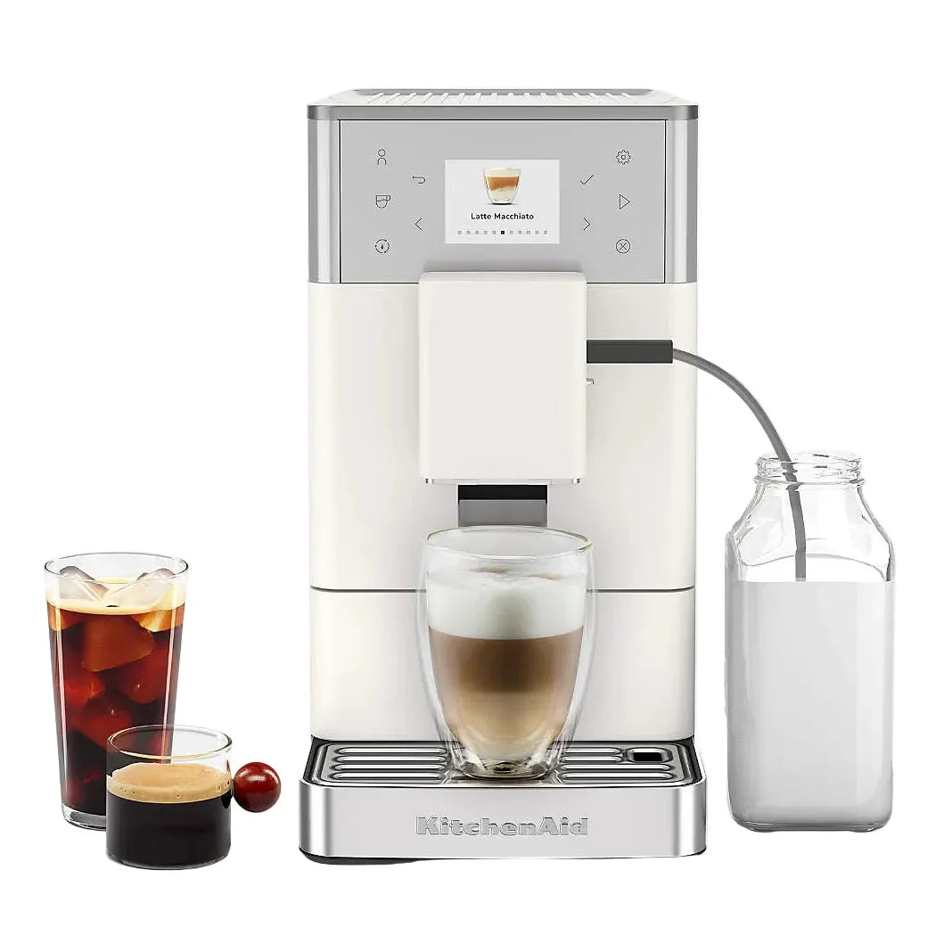 KitchenAid coffee machine with a glass of coffee, milk, and a jar on a white background