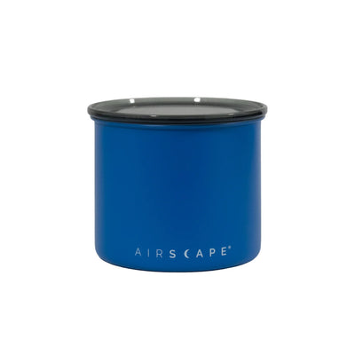Blue container with black lid on a white background