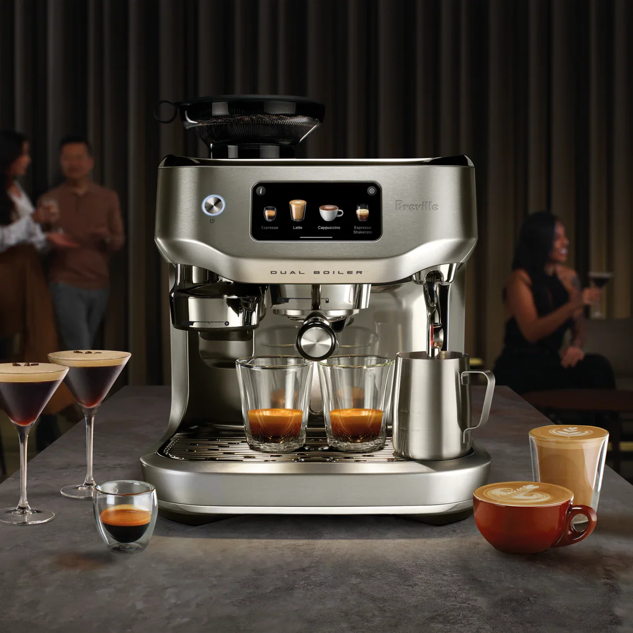 Breville coffee machine with various coffee beverages on a table