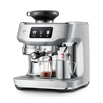 Silver Breville espresso machine on a white background