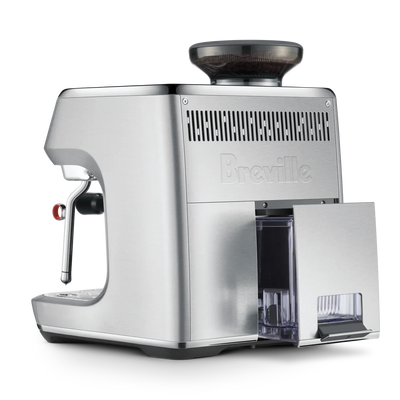 Silver Breville espresso machine on a white background