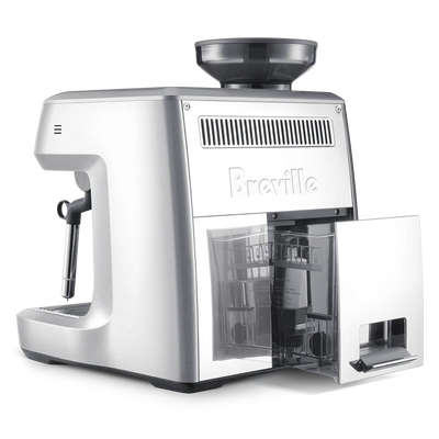 Silver coffee machine with a clear glass door on a white background