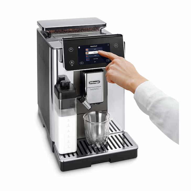 De'Longhi PrimaDonna Class coffee machine with a hand interacting with the touchscreen on a white background