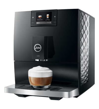 Modern coffee machine with a cup of coffee on a white background