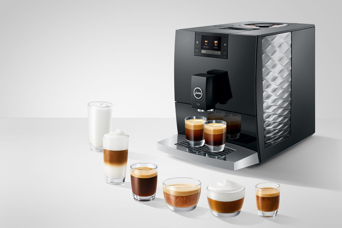 Black coffee machine with six glasses of different coffee drinks on a white background