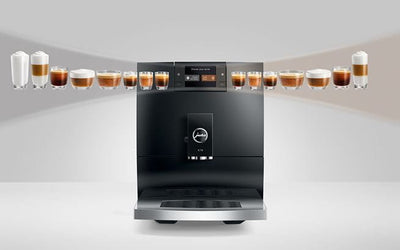 Modern coffee machine with various coffee beverages displayed around it on a white background