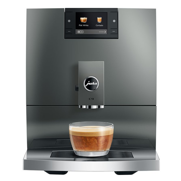 Modern coffee machine with a glass of coffee on a white background
