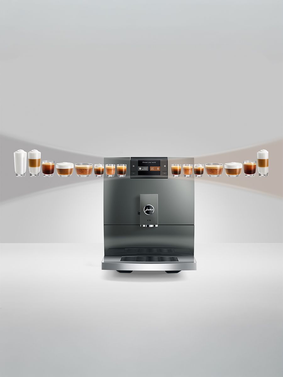 Stainless steel coffee machine with multiple cups of coffee on a white background