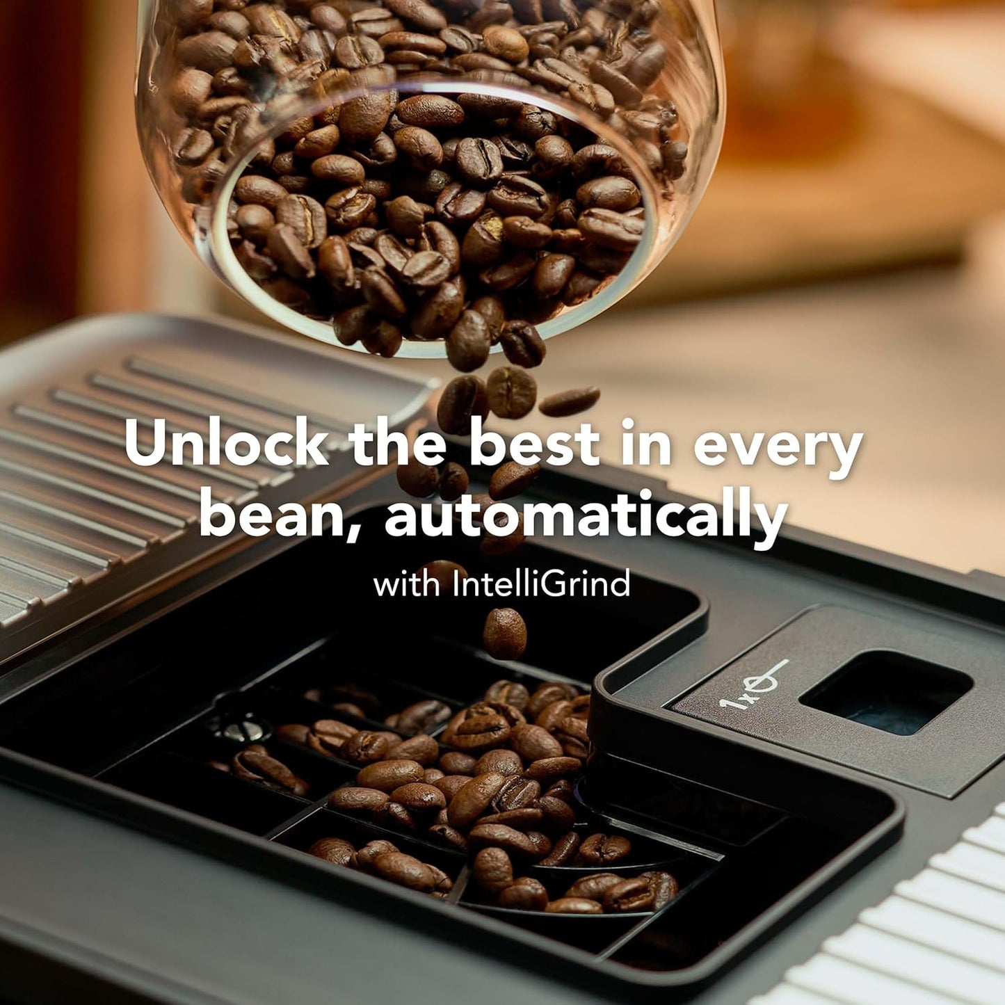 Coffee grinder with coffee beans spilling out, featuring text about IntelliGrind technology.