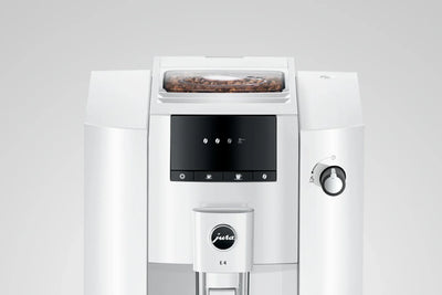 White coffee machine with a screen and control panel on a light gray background