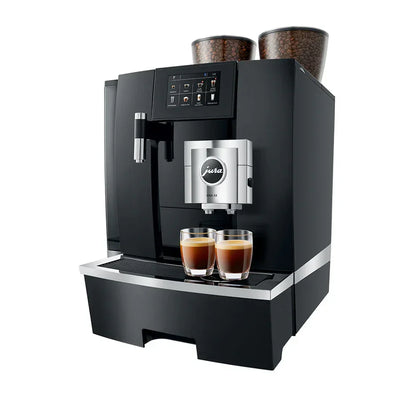Black coffee machine with two glasses of coffee on a white background